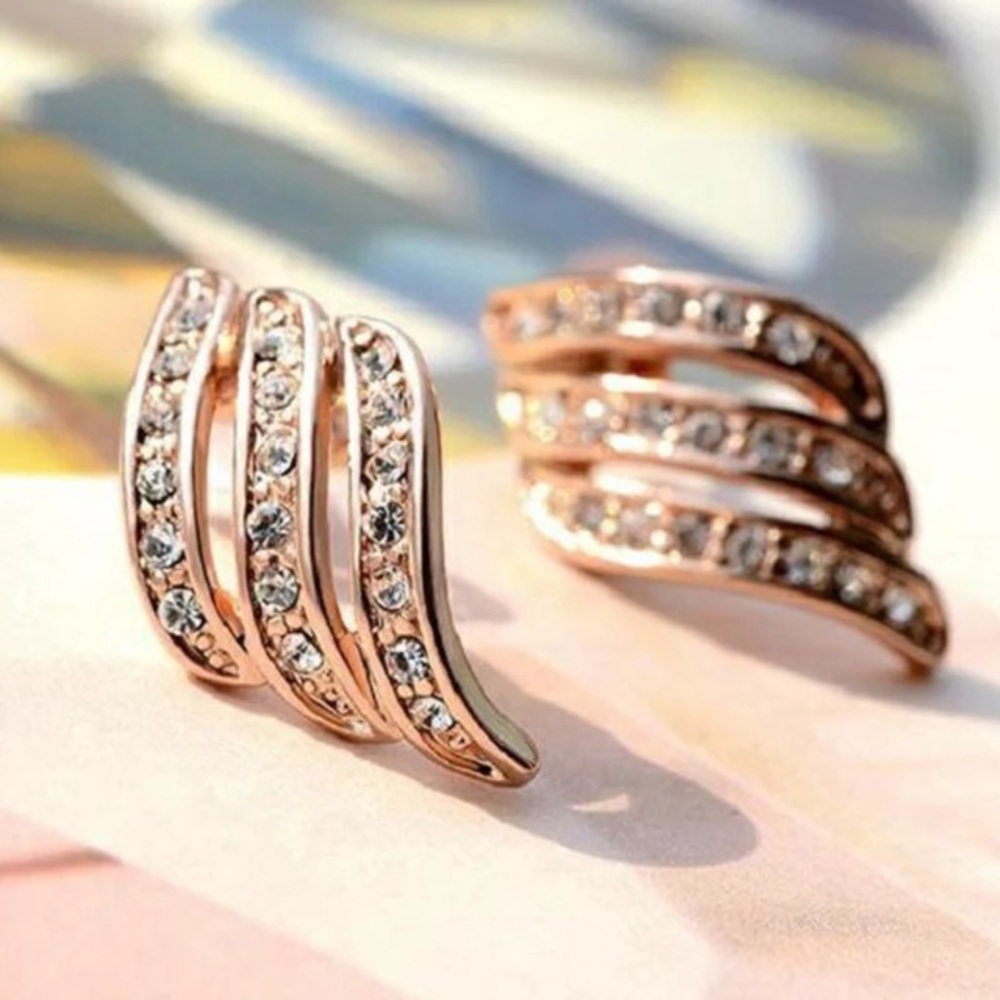 Gold crystal huggie style earrings